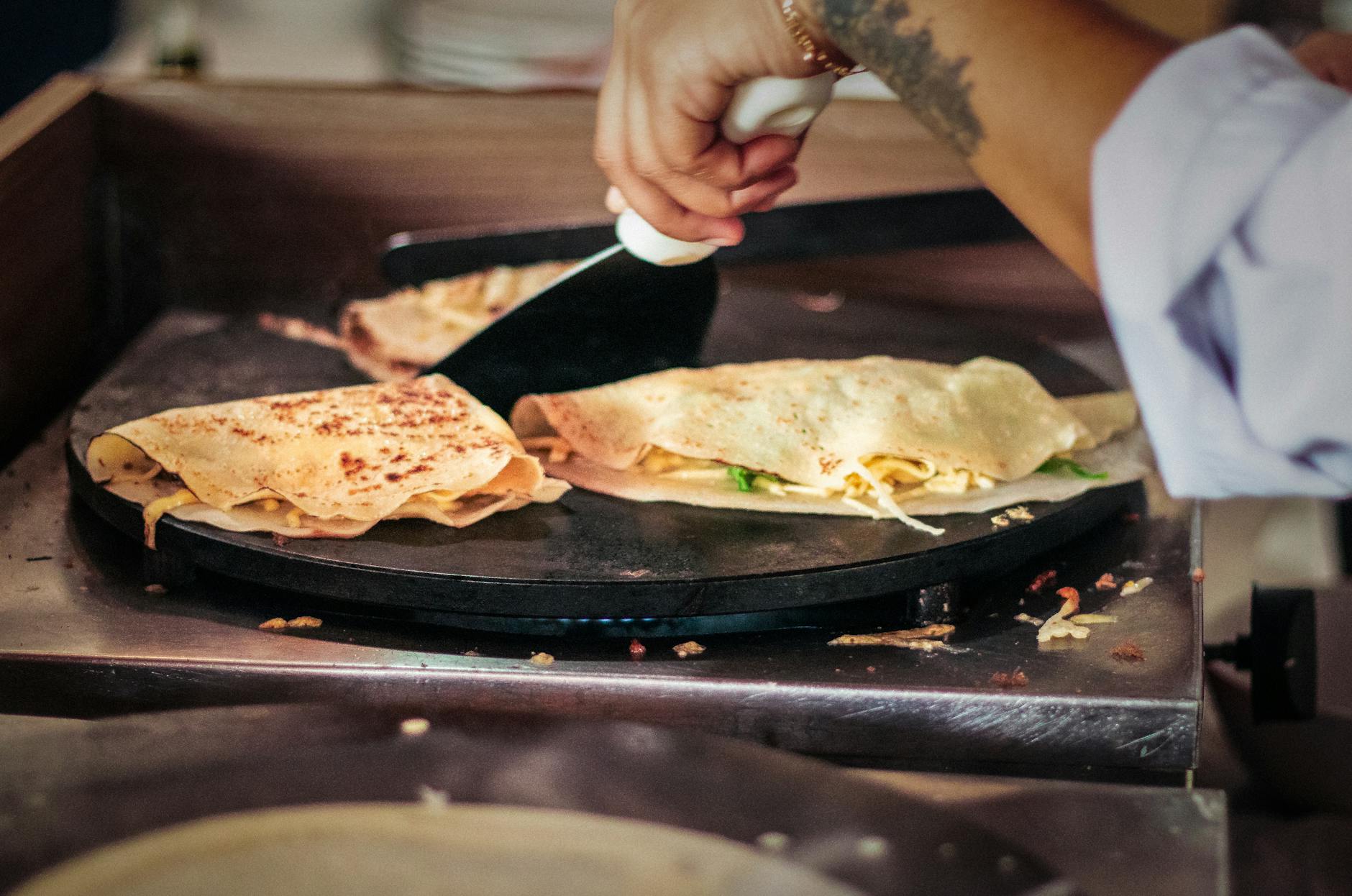 preparing delicious crepes in brazilian market